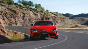 Toyota Supra driving on curved road